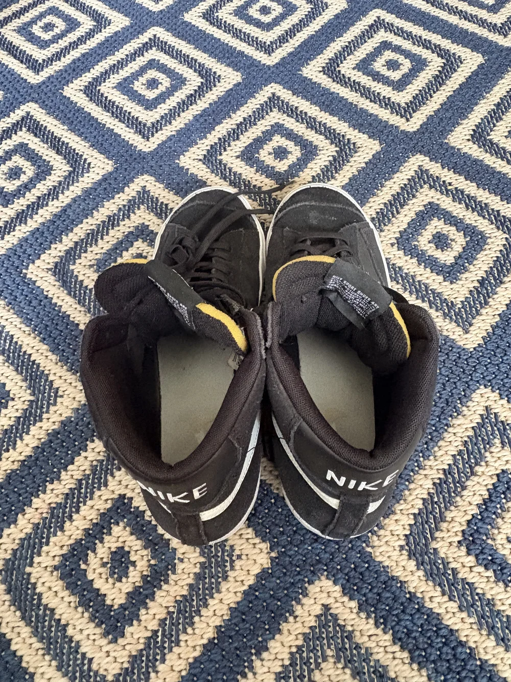 Nike Black High-Top Sneakers with White Swoosh and Yellow Accents